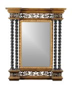 A large gilt and ebonised wall mirror , late 20th century, by Harrison & Gil, the cornice above a