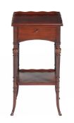 A mahogany two tier bedside table, late 19th/ early 20th century, the rectangular top with waved