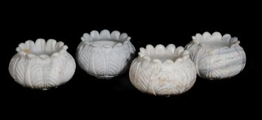 A set of four Indian carved marble jadinieres in the form of stylised lotus flowers, 20th century,