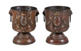 A pair of Continental repousse worked brass twin handled jardinieres or wine coolers, late 19th