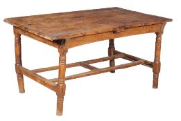 A yew and pine 'cottage' table, first half 19th century, the triple plank pine top above the solid