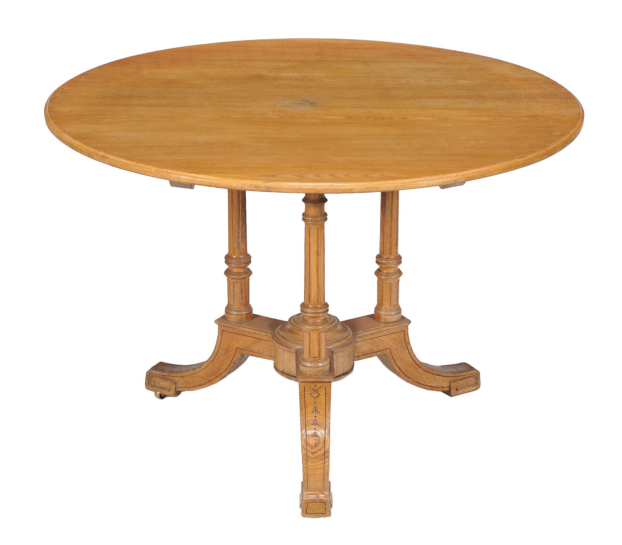 A Victorian ash circular centre table , circa 1860, attributed to Gillows, with fluted supports