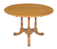 A Victorian ash circular centre table , circa 1860, attributed to Gillows, with fluted supports