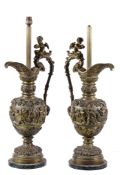 A pair of substantial Continental gilt bronze ewers fitted as table lamps, circa 1900, in the