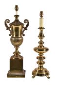 A gilt brass table lamp modelled as a twin handled urn, 20th century, the electrical fitment above