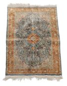 A silk rug, approximately 127cm x 77cm