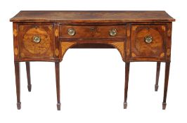 A George III mahogany and inlaid sideboard, circa 1790, of serpentine outline, 88cm high, 151cm