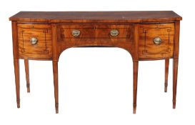 Ω A Regency mahogany and ebony strung sideboard , circa 1815, of break bowfront outline, 93cm high,