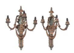 A pair of Italian painted and gilt composition three light wall appliques, early 20th century, the