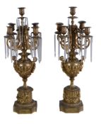 A pair of French gilt metal and glass hung five light lustre candelabra, circa 1875, each with an