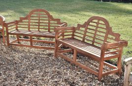 A pair of teak garden seats in the manner of designs by Lutyens, of recent manufacture, the arched