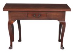 A George II mahogany 'fold out' side table, circa 1750, of unusual design, the hinged top opening