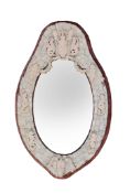 Ω A Dieppe carved ivory and bone framed oval wall mirror, circa 1875, the armorial cresting with