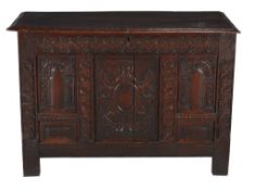 A carved and panelled oak chest , second half 17th century, the front incorporating arch and