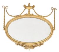 A giltwood and composition wall mirror , second half 19th century, in the manner of Robert Adam,