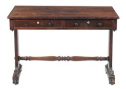 Ω A George IV rosewood library or writing table, circa 1825, the frieze incorporating a pair of