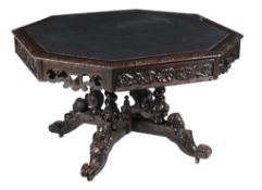 A Victorian carved oak octagonal library table , circa 1870, with four frieze drawers, 78cm high,