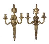 A pair of gilt bronze three light wall appliques in Louis XVI style, late 19th century, each with