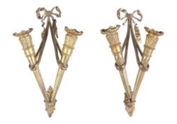 A pair of gilt bronze twin light wall appliques in Louis XVI style, 20th century, each modelled as