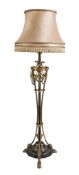 A gilt and patinated metal standard lamp in Neoclassical style, second quarter 20th century, the