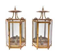 A pair of brass and glazed wall lanterns in early 19th century taste, 20th century, each with a