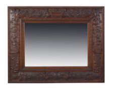 A Renaissance revival carved walnut rectangular wall mirror by Collinson & Lock, late 19th century,