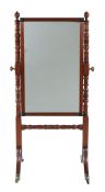 A George IV mahogany and parcel ebonised cheval mirror , circa 1825, 162cm high, 82cm wide, 63cm