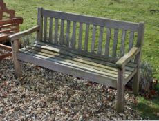 A teak garden seat, modern, with slatted back and seat, 90cm high, 153cm wide