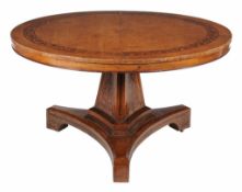 Ω A partridgewood and rosewood marquetry inlaid centre table in Regency style , possibly