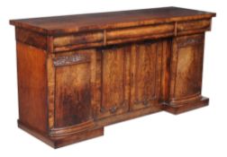 A William IV mahogany sideboard, circa 1835, with three cushion moulded frieze drawers above four