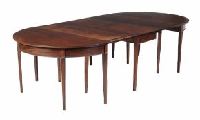 A George III mahogany dining table , circa 1800, with a pair of D-ends and central drop leaf