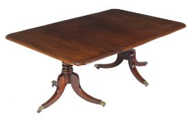 A Regency mahogany twin pedestal dining table , circa 1815, with single additional leaf insertion,