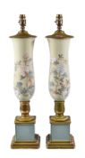A pair of reverse painted glass vases giltwood mounted as table lamps, 20th century, of slender