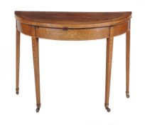 A George III mahogany and marquetry inlaid card table , circa 1790, the square section legs each