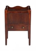 A George III mahogany night commode, circa 1790, the tambour compartment above a slide with lidded
