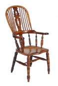 A Victorian yew and elm high back Windsor armchair, mid 19th century