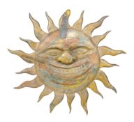 A carved, painted and giltwood wall decoration , in the form of a sun, 19th or first half 20th