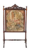 Ω A Victorian rosewood firescreen , circa 1850, with needlework scene depicting figures by a