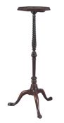 A George III mahogany torchere or candlestand, circa 1760, the hexagonal top with shallow gallery,