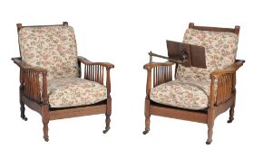 A pair of oak 'steamer' chairs , early 20th century, one with a Carter's patent reading stand to