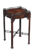 A mahogany occasional table, in George III style, 19th century, the serpentine sided spindle