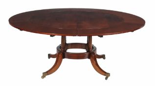 A plum pudding mahogany circular concentric extending dining table, in 19th century style, second