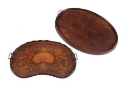 A George III mahogany oval tray , late 18th century, with twin brass loop handles, 71cm wide, and
