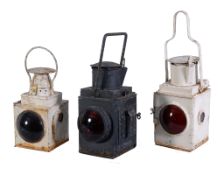 A Collection of three British Railway lamps, B.R. tail lamp in black, L.T. tail lamp in white and a