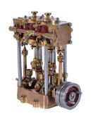 A well-engineered model of a live steam twin cylinder launch engine, built in bronze and polished
