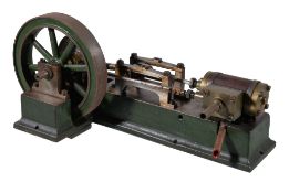 An early 20th century live steam model of a horizontal mill engine, having six spoked flywheel
