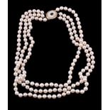 Y A three row cultured pearl necklace, the uniform cultured pearls on knotted strands, to a