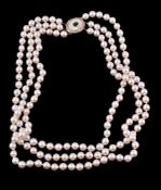 Y A three row cultured pearl necklace, the uniform cultured pearls on knotted strands, to a