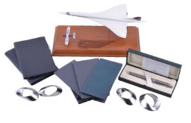 A collection of British Airways Concorde related memorabilia, comprising: a plastic model of