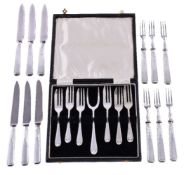 A set of six silver fruit forks and knives by B. & H., Sheffield 1937, the knives with stainless